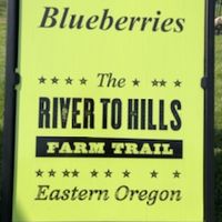 sign that reads K & K Blueberries - The River to Hills Farm Trail - Eastern Oregon